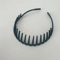 Deep grey plastic headband with toothed design for hair styling and securing stray hairs - Gray