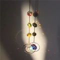 Crystal suncatcher with moon and star metal chain reflecting rainbows on wall - US 3