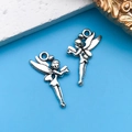 Pair of vintage silver alloy fairy charms for DIY jewelry making on blue background - Flower Fairy Angel 15x24mm