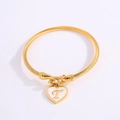 Gold twisted rope open bangle with heart charm featuring a letter T on white background - Letter T