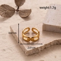 Adjustable golden stainless steel hollow heart chain ring on stone display - Chain Design (MN494)