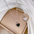 Close-up of minimalist double-sided heart pendant with fine beaded edges and crystals - Titanium Steel / Steel Color (M431)