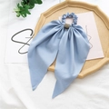 Blue fabric scrunchie with sparkling rhinestone center on a rustic wooden tray decoration - Rhinestone Waist Buckle Style / Blue