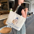 Off-white canvas tote bag featuring a cute cartoon alpaca and 'I want to travel' slogan - Strolling Bear