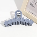 Close-up of a 13cm matte blue-gray flower hair claw clip on a white minimalist surface - Blue Gray