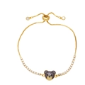 Fashionable golden adjustable bear bracelet with purple zircons and sliding clasp - Purple