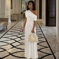 Detail of elegant white off-shoulder ruched maxi dress with flowing silhouette in indoor setting - S / White