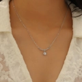 Close-up of minimalist heart necklace with sparkling zircon pendant on model neck - V-Shaped Zirconia Clavicle Necklace (H-173) / Silver