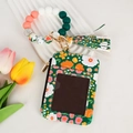 Detail of floral zipper card wallet with silicone beaded bracelet and tassel keychain - Dark Green Floral