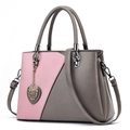 Pink and brown patchwork handbag with metal heart charm and adjustable shoulder strap - Dark Grey and Pink