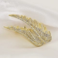 Elegant gold feather brooch with sparkling crystals on white silk background for suits - Gold