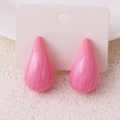 Pink teardrop earrings with marble texture and glitter finish on display card - Pink