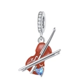 Detail view of heart music charm with red enamel and blue gemstone inlay - Red Heart Violin