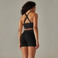 Detail of seamless black cross-strap sports bra and high-waist shorts set back view - S / Top And Bottom / Cross Bra + Shorts / Black