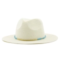 Detailed view of woven straw fedora with blue beads and gold decorative accent - Creamy White