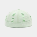 Close-up of light green docker cap featuring distressed holes and neon green inner lining - Adjustable / Light Green