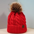 Red cable knit beanie with faux fur pompom and leather logo patch for winter warmth - One Size / Red