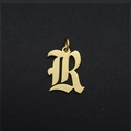 Close-up of a gold-plated Gothic letter R pendant in stainless steel for DIY jewelry - Letter R