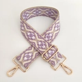 Close-up of jacquard woven strap with purple ethnic pattern and gold metal buckles - White Purple Floral