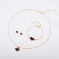 Golden jewelry set with black heart pendants including necklace, bracelet and earrings - Coffee