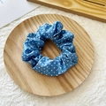Blue satin scrunchie with white polka dots on a round wooden tray, minimalist hair tie - Blue White Dots