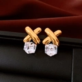 Macro view of gold cross stud earrings with clear faceted crystal cube pendants - Silver Pin - Transparent Glass Style / Gold-Clear
