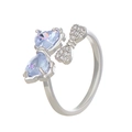 Silver bow ring with light blue heart-shaped zircons and micro-set crystals - Silver Light Blue Heart Bow (DZ-405)