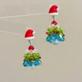 Macro detail of handmade beaded Christmas tree earrings with a festive red Santa hat stud - Christmas Hat-Pair / Stud Earrings