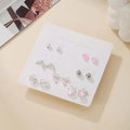 7-day earring set featuring silver heart shapes and pearls on a white display card - Pink Heart Knot Pearl Style (E1995-1)