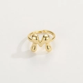Detailed view of the gold-plated M letter ring with a smooth liquid metal finish - Gold Ring M