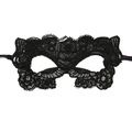 Close-up of black lace masquerade mask with intricate floral hollow out patterns - Catwoman