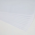 Stack of transparent self-adhesive PVC cat scratch furniture protector sheets - 15*30cm