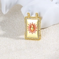 Macro detail of a gold heart charm with red rays and zircon borders for DIY jewelry - Red Sacred Heart Style (ZYN-DMK869G-1)