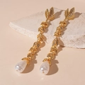 Detail view of long gold leaf earrings with rhinestones and a baroque pearl drop - Gold Flower Leaf Drop Earrings (925 Silver Needle)