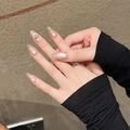 Pink cat eye handmade press-on nails in almond shape on hand with subtle pearlescent shimmer - XS / Medium Oval Style (2197)
