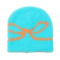 Close-up of the plush knit texture and orange bow jacquard on the blue beanie hat - M (56-58cm) / Lake Blue