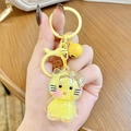 Cute yellow kitty oil liquid quicksand keychain with yellow bell and lobster clasp charm - Yellow Hello Kitty Milk Bean