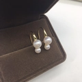 Detail view of double freshwater pearls on gold-toned hooks in a velvet jewelry box - 4-6.5mm Double Round Freshwater Pearls Sterling Silver High Heel