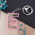 Pink acrylic letter E keychain with colorful sequins and silver metal ring for bags - Letter E