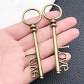 Chiavi vintage in bronzo con incisione LOVE per ciondoli e gioielli fai-da-te - Chiave con Lettere Love in Bronzo Antico 10x78mm