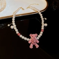 Detail of a pink flocked bear pendant with shimmering rhinestones on a pearl necklace - Faux Pearl/Flocking/Rhinestone/Alloy / Pink Flocked Bear Faux Pearl Necklace (HN1845)