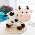 Lindo peluche de vaca con manchas negras de corazón y bufanda a cuadros amarilla - 25cm / Blanco