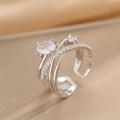 Anello aperto in argento a incrocio con pietre di zirconia su tessuto champagne - Acciaio/Argento (651)