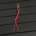 Detail shot of a red hand-woven keychain rope with a metallic climbing carabiner hook - Red