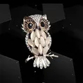 Elegant gold-tone owl brooch with white opal stones and sparkling crystal accents - Owl / Owl