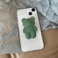 3D matte dark green bear expandable phone socket stand on a white smartphone - Transparent Stand / Green 3D Bear