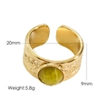 Detailed view of 9mm wide gold titanium ring with green gemstone and 20mm inner diameter - Mustard Stone