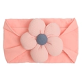 Detailed shot of baby nylon headband with large ribbed fabric flower and button center - Pink