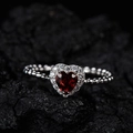 Macro shot of S925 sterling silver ring with heart-shaped garnet on black stone background - Natural Garnet Heart Ring LR338