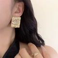 Gold square stud earrings featuring a unique bark texture and geometric pleated design - Pleated Geometric Square Style / Gold